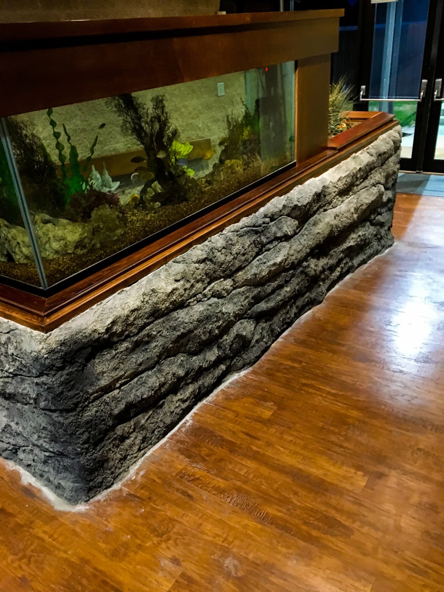 Faux rockwork integrated with aquarium architecture