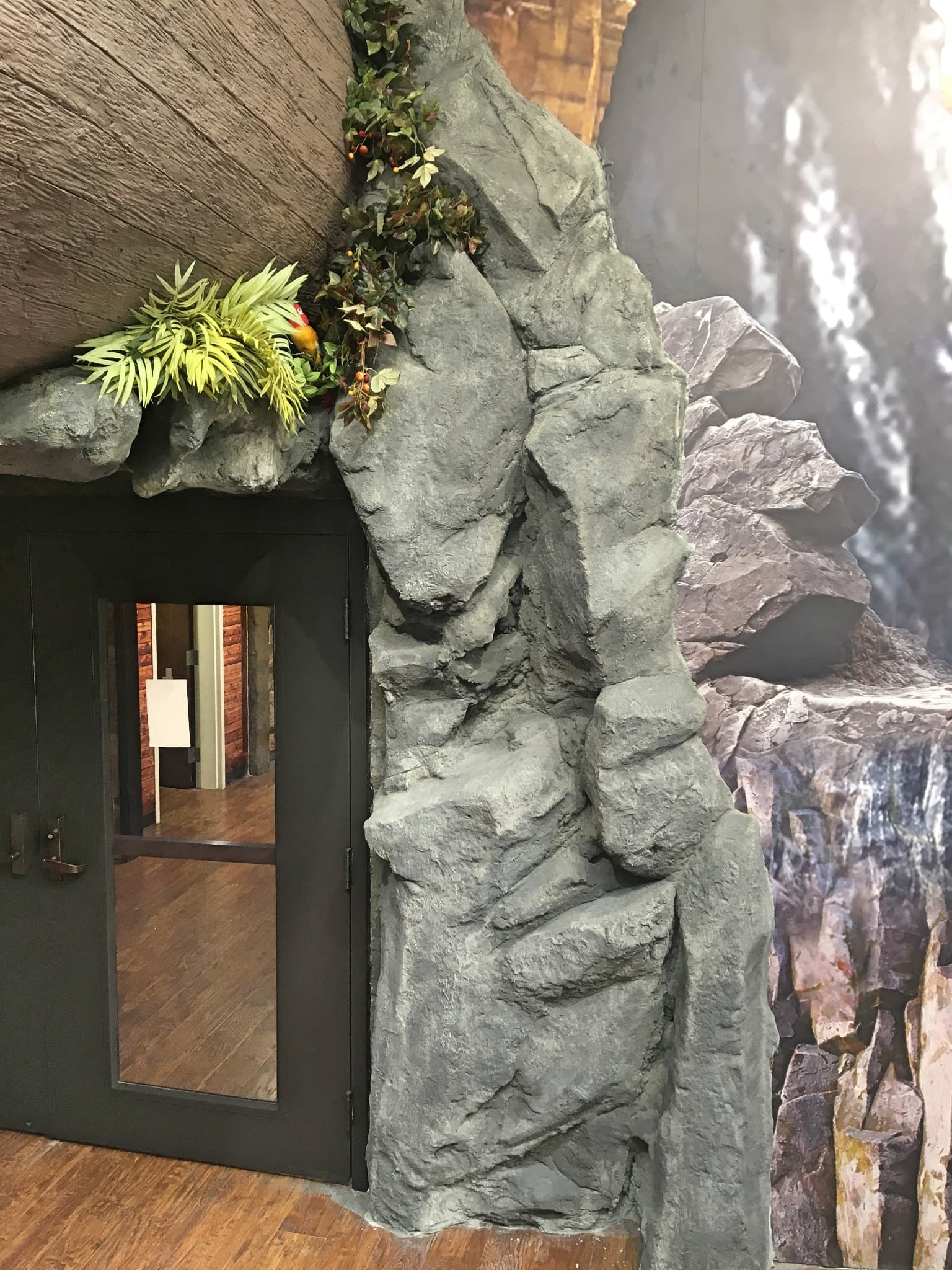 Faux rockwork integrated around a doorway