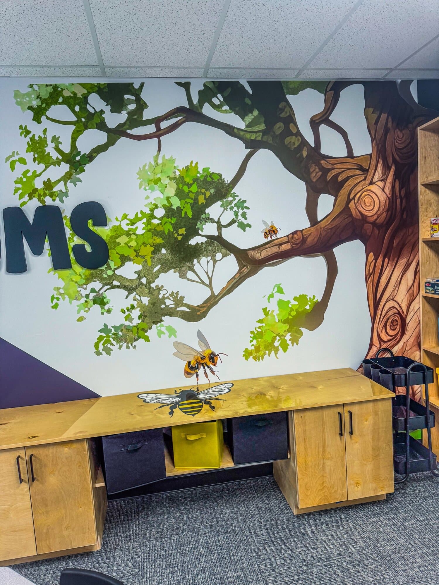 Buds and Blooms classroom mural and custom cabinetry detail