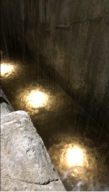 Water and integrated lighting inside the rock feature